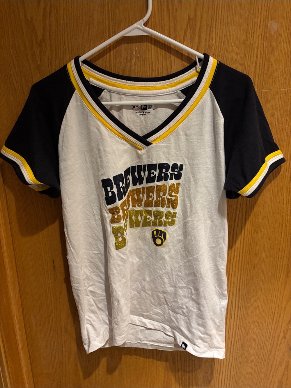 New Era, junior’s short sleeve Brewer tee
White with navy blue and yellow, Large